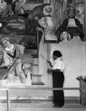 Lucia working on the Building of the Morning Star mural